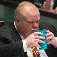 Rob Ford drinking his signature glass of milk.